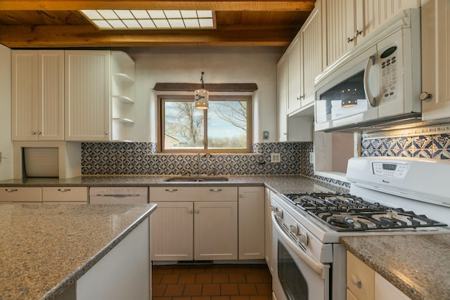 kitchen featuring wooden ceiling, dark tile patterned flooring, white appliances, a sink, and backsplash