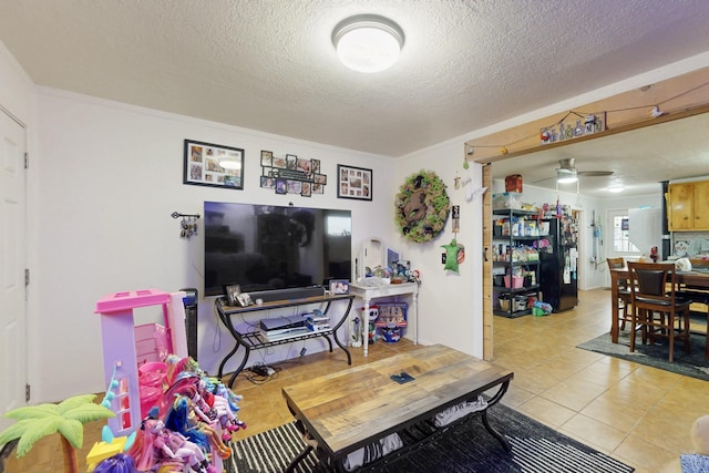 503 US Rt 66, Moriarty, NM 87035 - living room featuring light tile patterned floors, a textured ceiling, and a ceiling fan