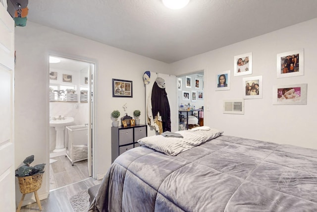 503 US Rt 66, Moriarty, NM 87035 - bedroom with wood finished floors and connected bathroom