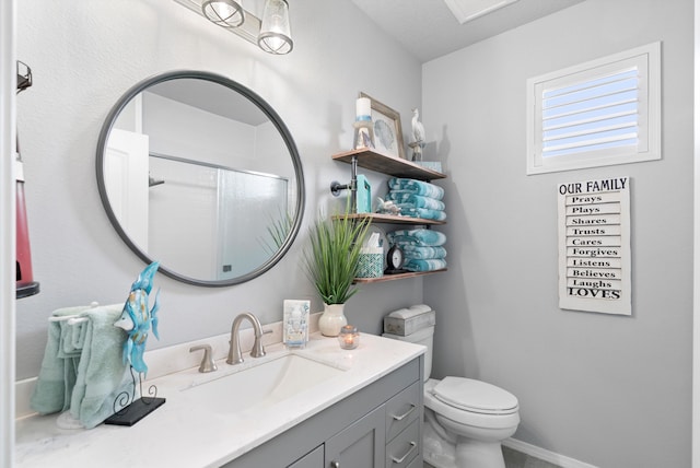 full bath featuring toilet, walk in shower, vanity, and baseboards