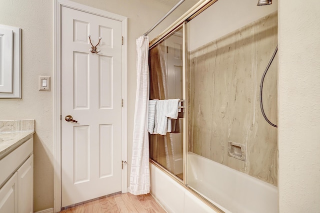 full bathroom featuring shower / bath combo with shower curtain, vanity, and wood finished floors