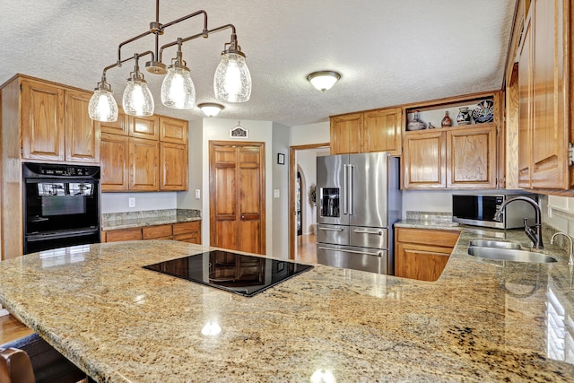 kitchen featuring a sink, black appliances, open shelves, and light stone countertops