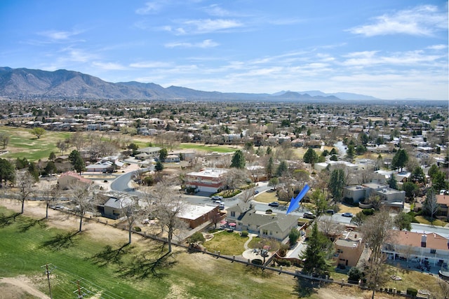 drone / aerial view featuring a residential view and a mountain view