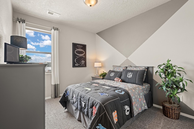 carpeted bedroom featuring visible vents, a textured ceiling, and baseboards