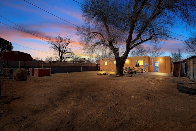 view of yard featuring fence and a patio