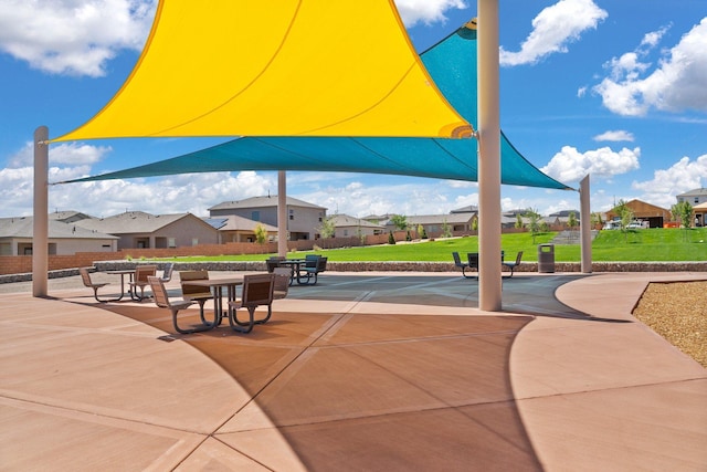 view of property's community featuring a residential view and a yard