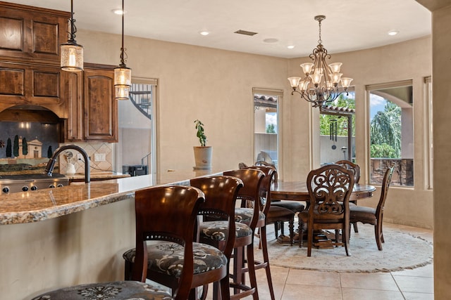 dining room with light tile patterned floors, an inviting chandelier, visible vents, and recessed lighting