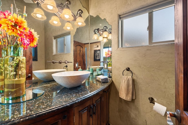 bathroom featuring plenty of natural light and vanity