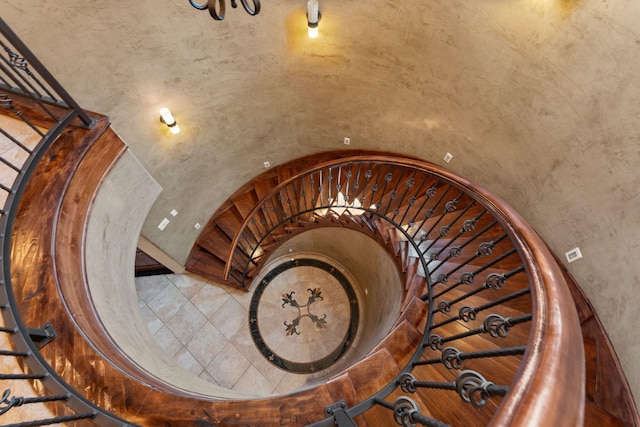 staircase with vaulted ceiling