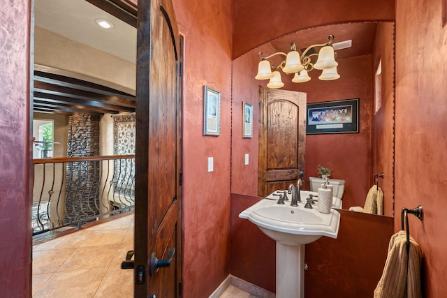 bathroom with tile patterned flooring and toilet