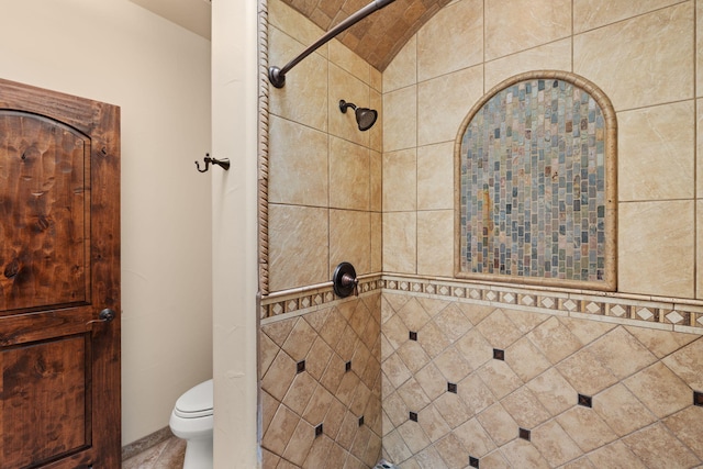 bathroom with walk in shower and toilet