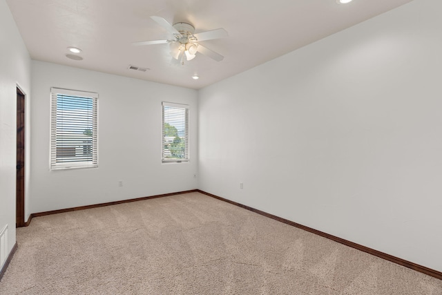 unfurnished room featuring recessed lighting, visible vents, a ceiling fan, light carpet, and baseboards