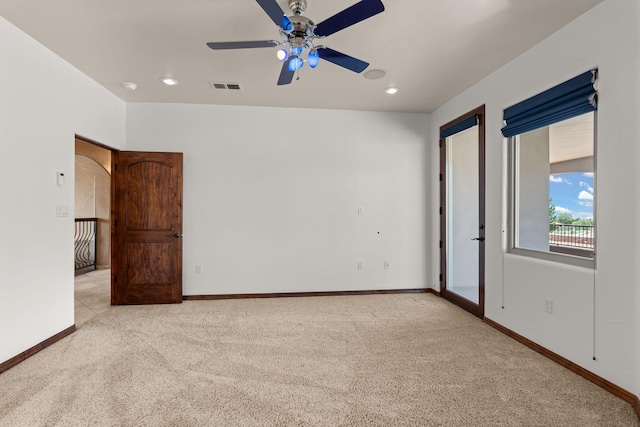 unfurnished bedroom featuring recessed lighting, light colored carpet, visible vents, ceiling fan, and baseboards