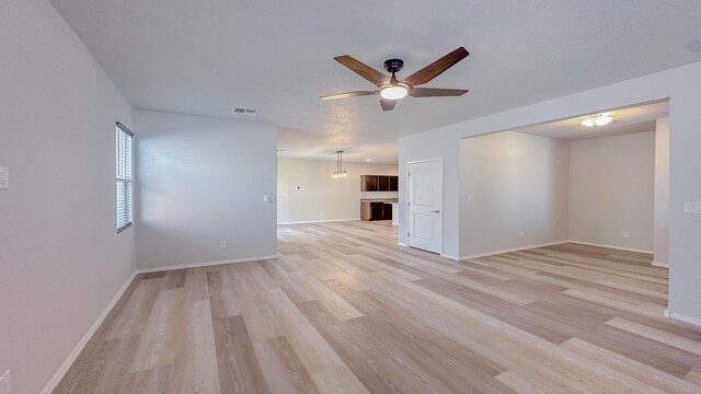 6053 Strand Loop SE, Albuquerque, NM 87106 - spare room with ceiling fan, light wood-type flooring, and baseboards