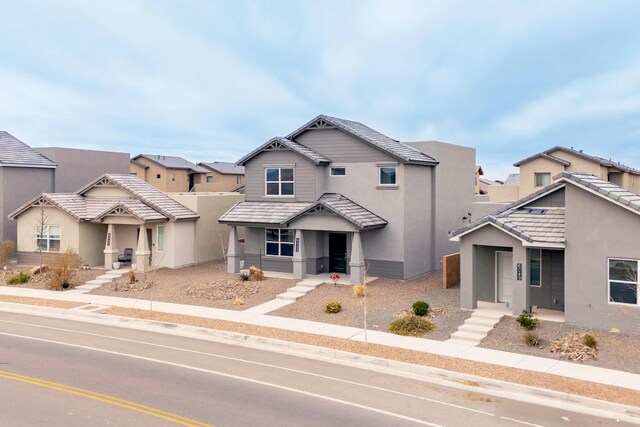 6053 Strand Loop SE, Albuquerque, NM 87106 - view of front of property featuring stucco siding, a residential view, and covered porch