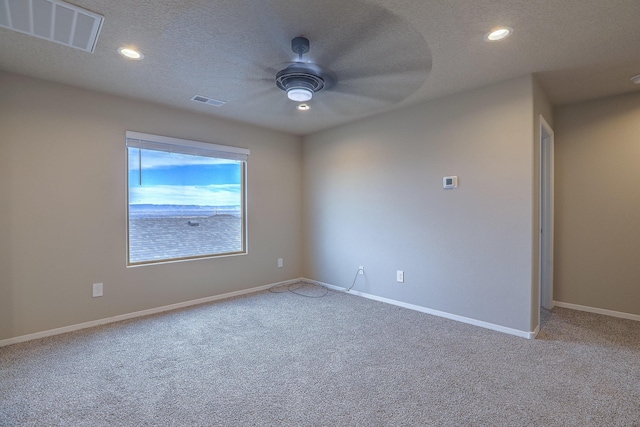 unfurnished room with ceiling fan, visible vents, and recessed lighting