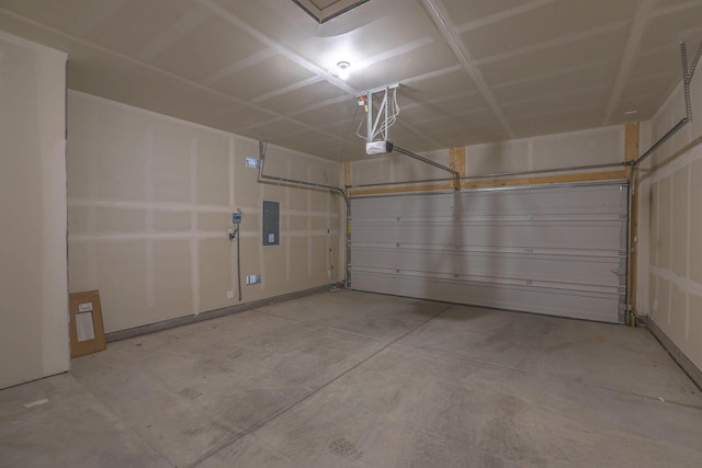 garage with electric panel and a garage door opener