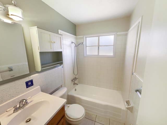 bathroom featuring washtub / shower combination, vanity, toilet, and tile patterned floors