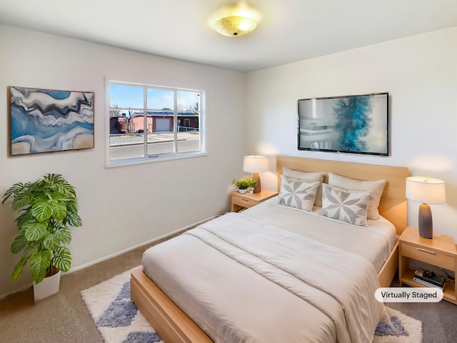 bedroom featuring carpet flooring and baseboards