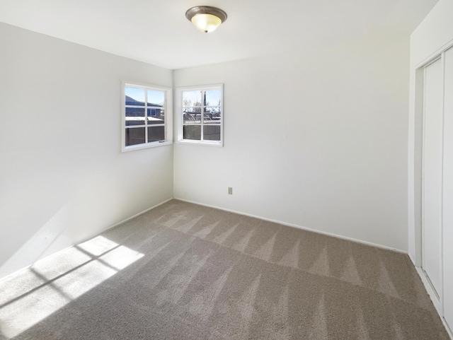 empty room featuring carpet flooring