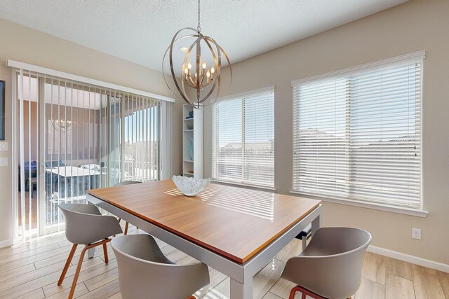 9020 Retablo Rd NW, Albuquerque, NM 87120 - dining room with baseboards, a notable chandelier, and light wood finished floors