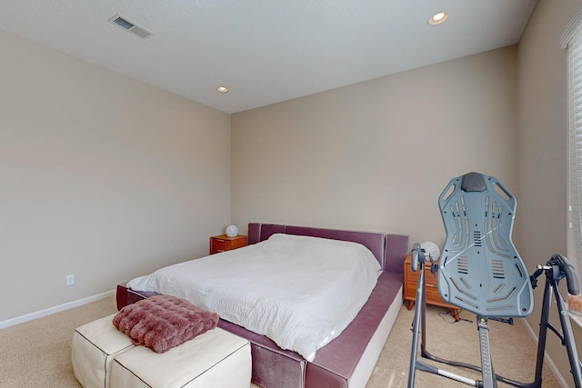 carpeted bedroom featuring recessed lighting, visible vents, and baseboards