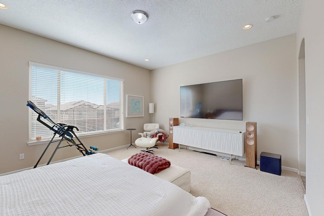 bedroom featuring recessed lighting, baseboards, a textured ceiling, and carpet flooring