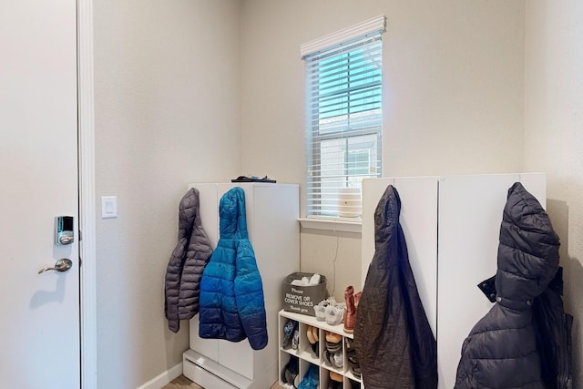 doorway to outside with baseboards