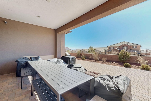 view of patio with a fenced backyard and outdoor dining space