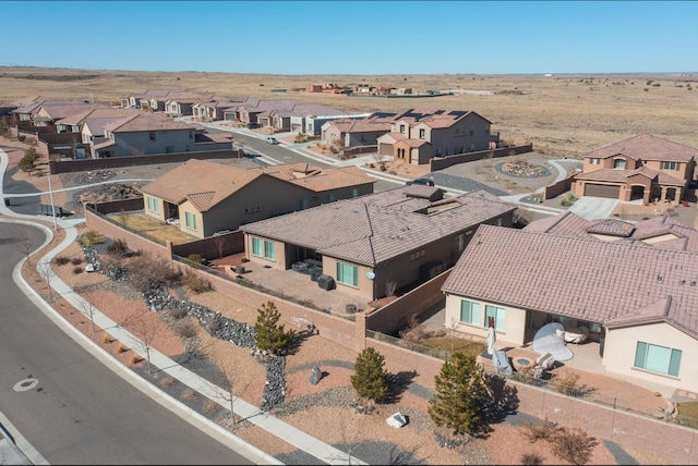 birds eye view of property with a residential view