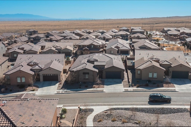 aerial view with a mountain view and a residential view