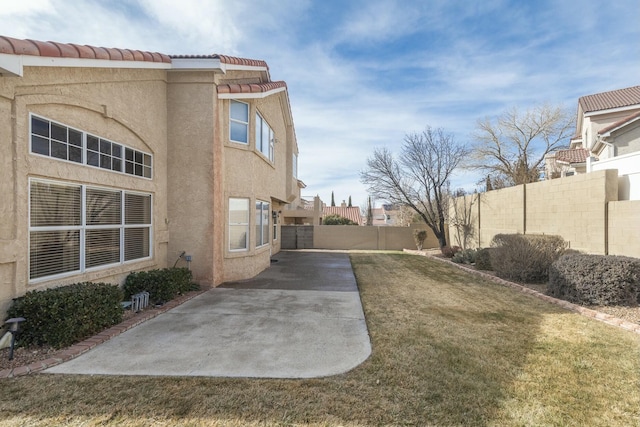 view of yard featuring a patio area and a fenced backyard