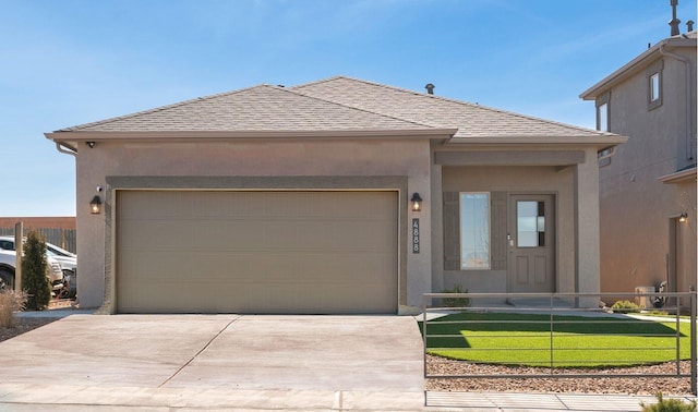 view of front of home with a garage, a shingled roof, fence, concrete driveway, and stucco siding