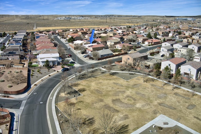 birds eye view of property with a residential view