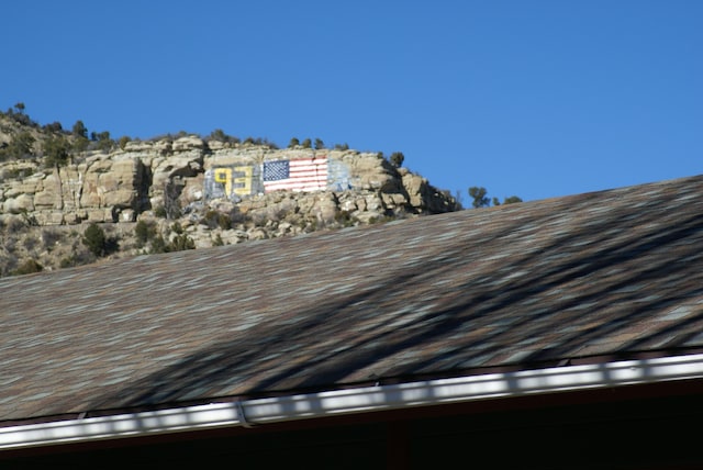 exterior details with a shingled roof