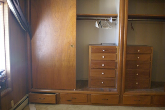 closet with a baseboard heating unit