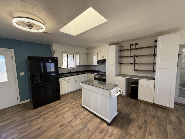 kitchen featuring dark countertops, white cabinets, and black fridge with ice dispenser