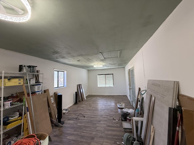 office space featuring dark wood-style flooring and baseboards