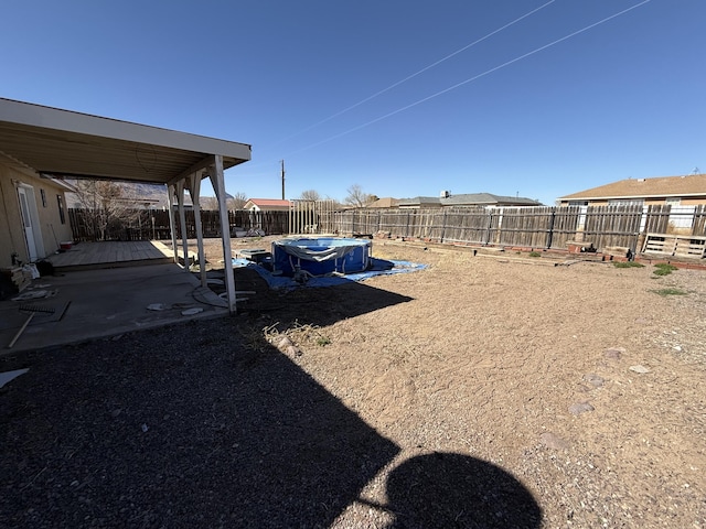 view of yard featuring a fenced backyard and a pool