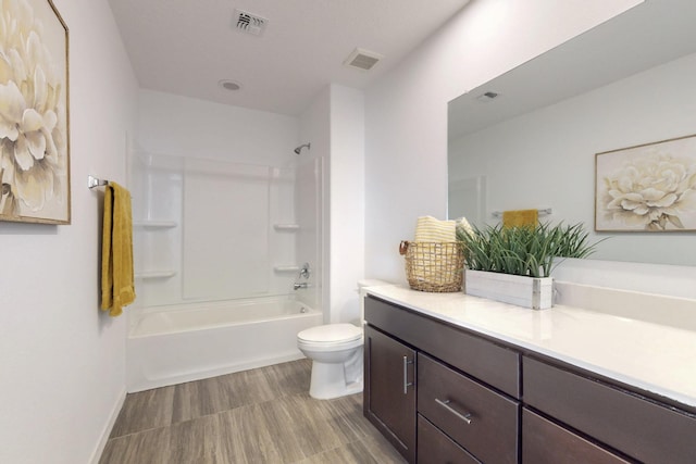 full bathroom with visible vents, shower / tub combination, vanity, and toilet