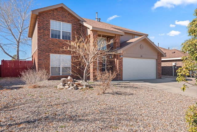 traditional home featuring a garage, concrete driveway, brick siding, and fence