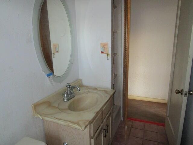 bathroom with tile patterned floors and vanity