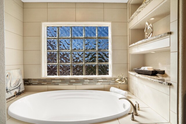 bathroom featuring a bath