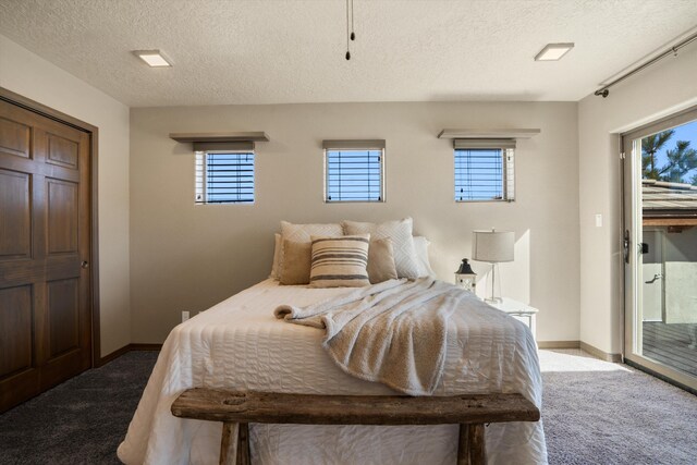 bedroom with a textured ceiling, carpet floors, access to outside, and baseboards