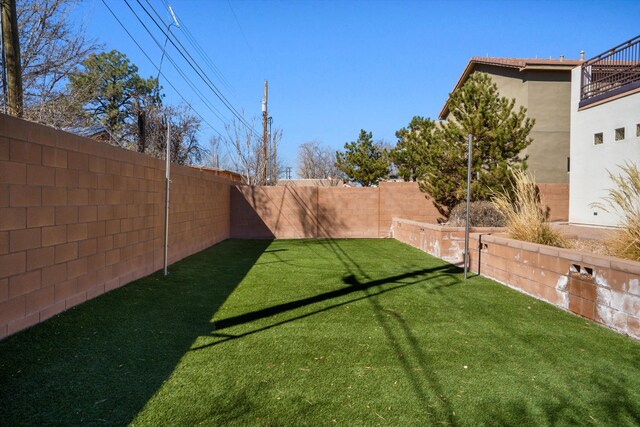 view of yard featuring a fenced backyard