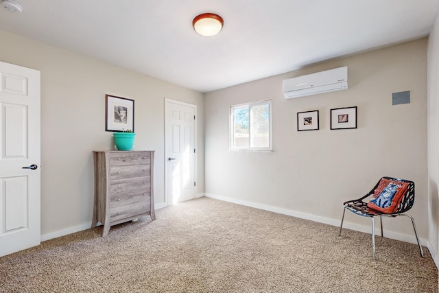 living area featuring carpet floors, baseboards, and a wall mounted AC