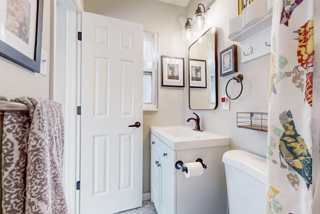 full bathroom with vanity and toilet