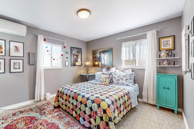 bedroom with multiple windows, a wall mounted AC, carpet floors, and baseboards