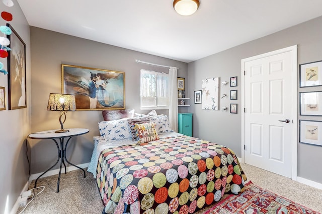 bedroom featuring carpet floors and baseboards