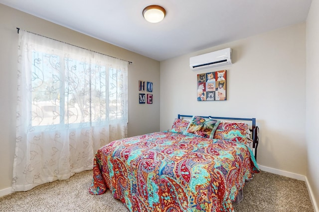 carpeted bedroom with baseboards and a wall mounted AC